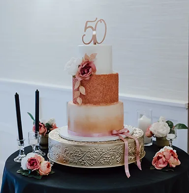Three level cake prepared for a 50th birthday party