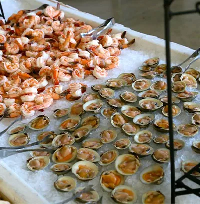 Shrimp and clams on ice at a catered event