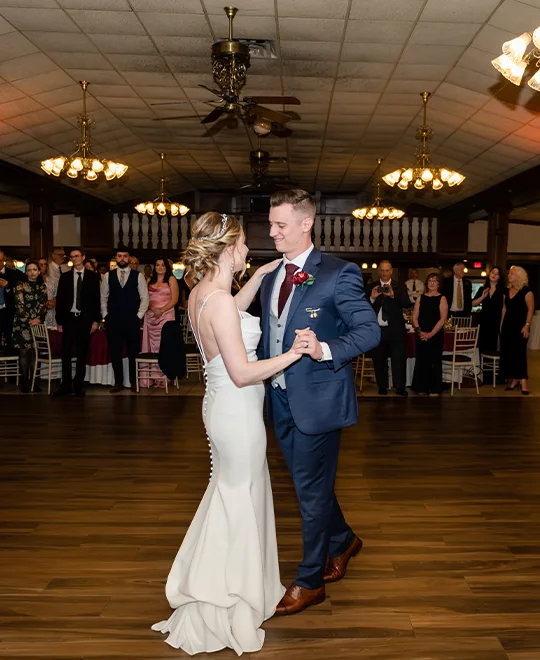 Newlywed couple dancing in the wagon room